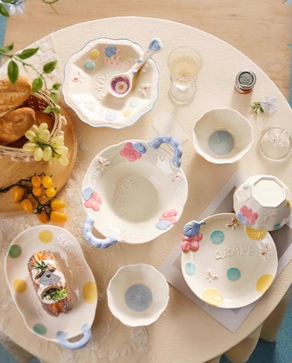 Set of ceramic dishes with floral designs on a round table in canada.