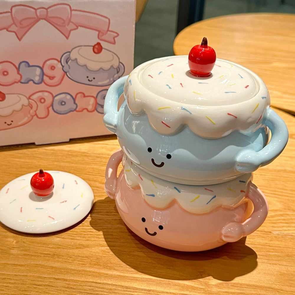 Cute ceramic cupcake-shaped container with a lid on a wooden surface.