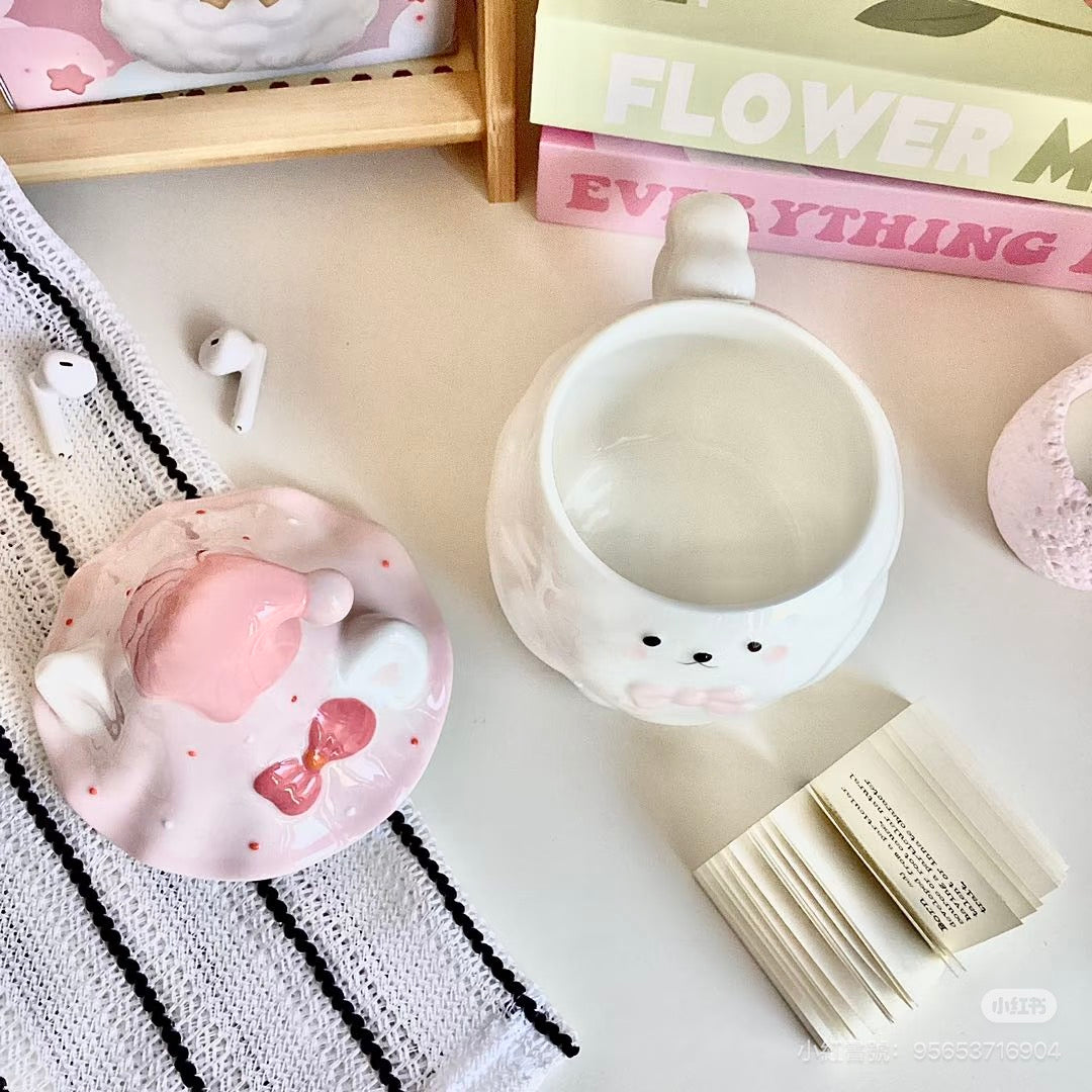 Ceramic Samoyed Mug on a white surface with books in the background