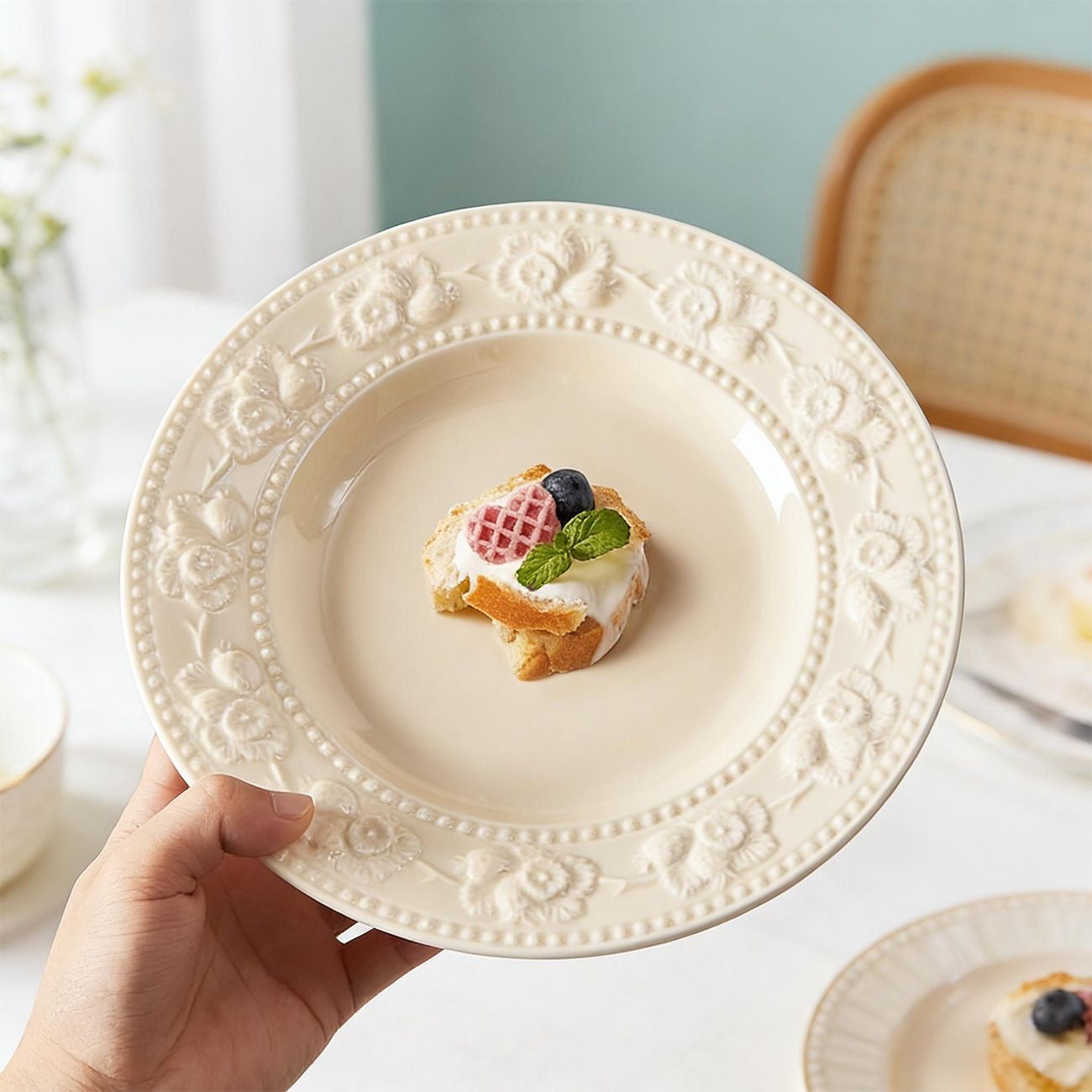 Two 8-inch ceramic plates with embossed floral borders